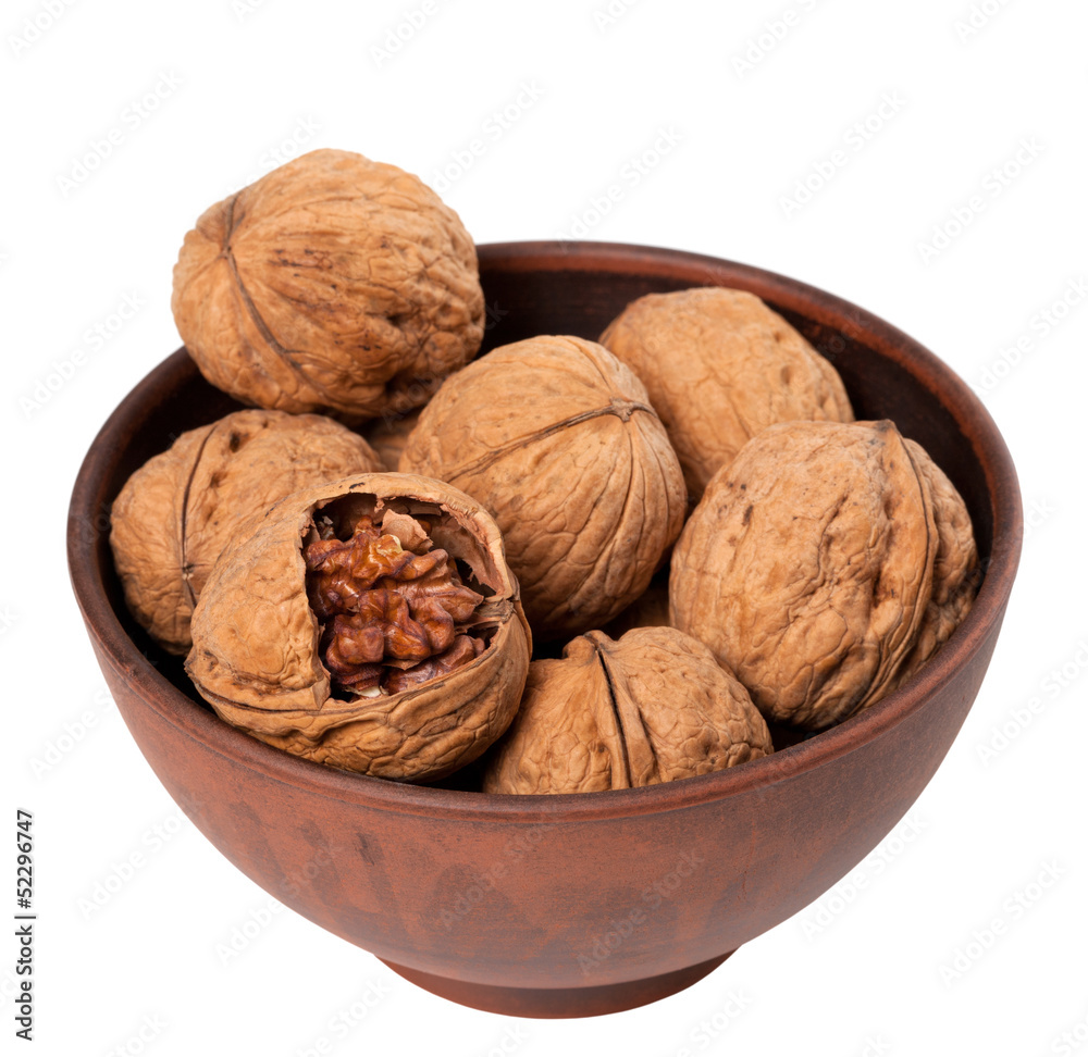 Walnuts in ceramic bowl Walnuts in ceramic bowl