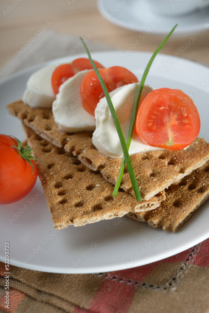 Snack with mozzarella and crisp bread Snack with mozzarella and crisp bread