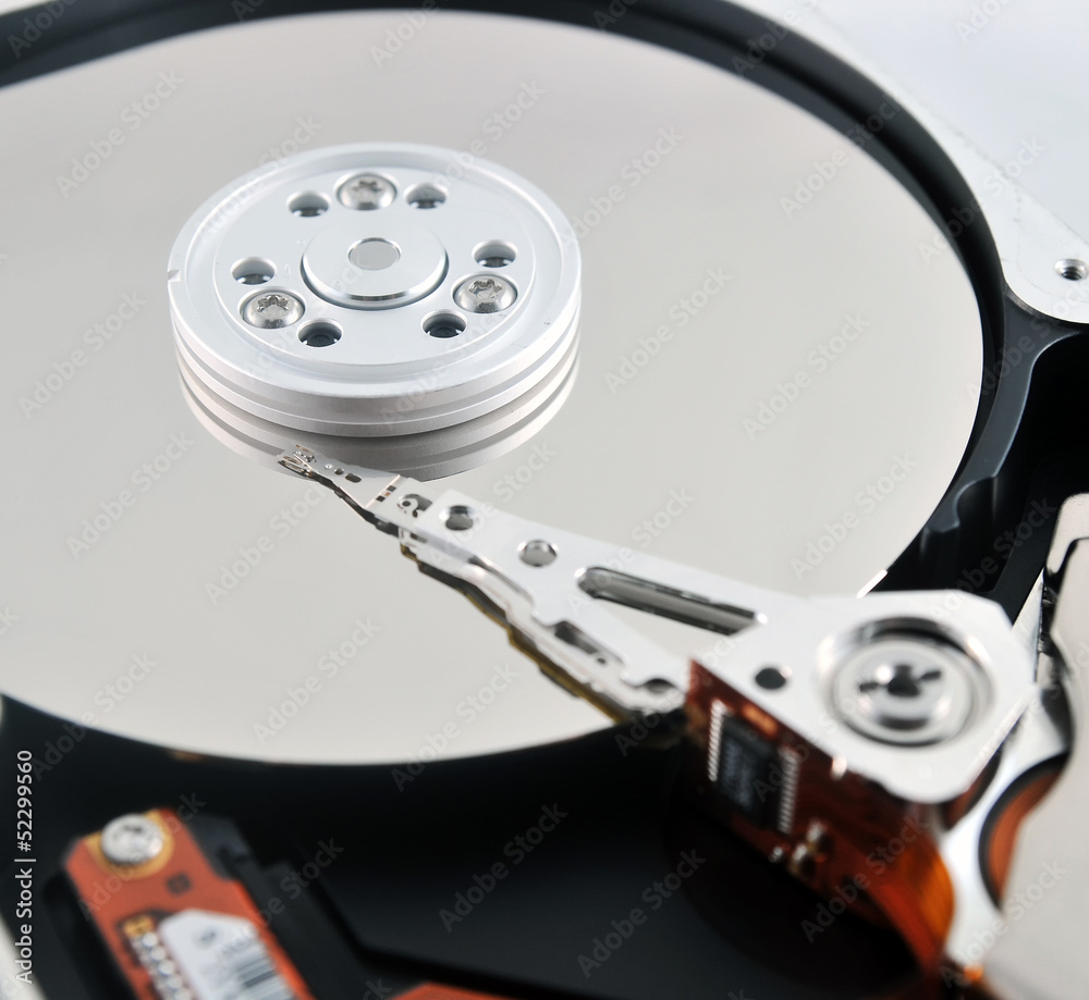 Close-up of internal components of a harddisk drive (HDD) Close-up of internal components of a harddisk drive (HDD)