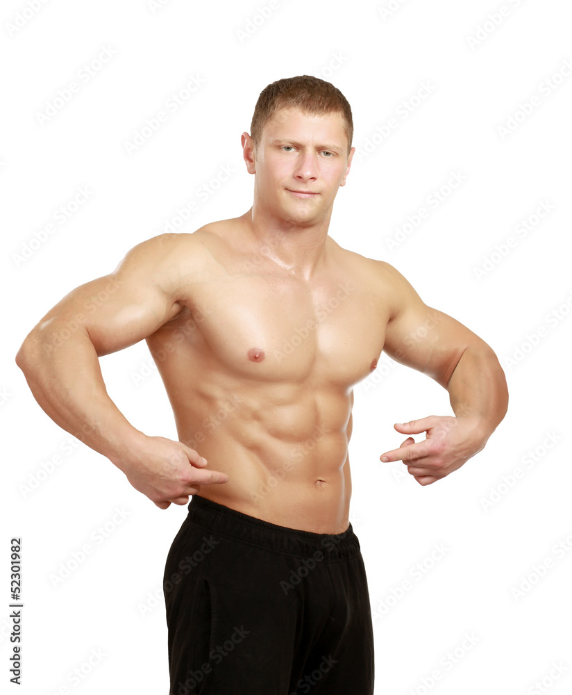 Muscular young man showing abs, isolated o white background Muscular young man showing abs, isolated o white background