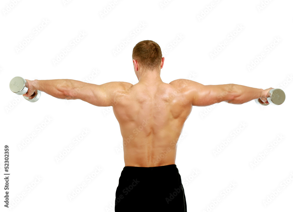 Handsome muscular man working out with dumbbells Handsome muscular man working out with dumbbells