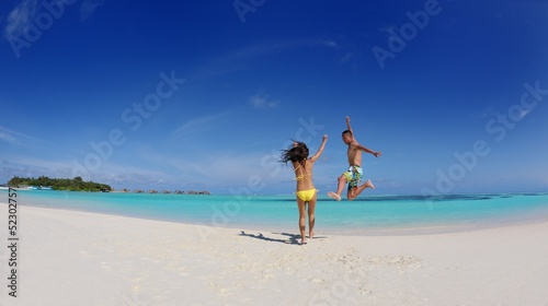 happy young  couple enjoying summer on beach