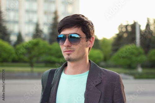 Attractive young guy wearing trendy glasses