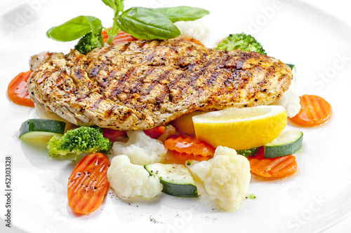 Tasty food. Grilled chicken breasts and vegetables . High qualit