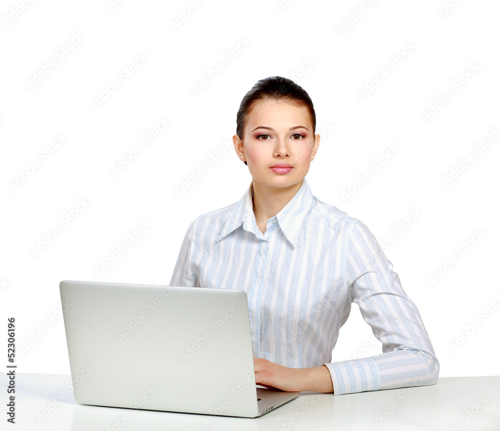 A young woman sitting in front of a laptop A young woman sitting in front of a laptop