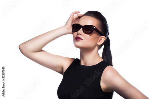 Portrait of beautiful and fashion girl in sunglasses, studio sho © merisabell