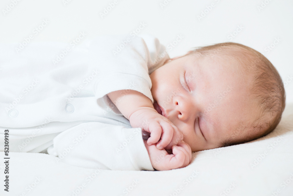 detail of adorable sleeping month old baby