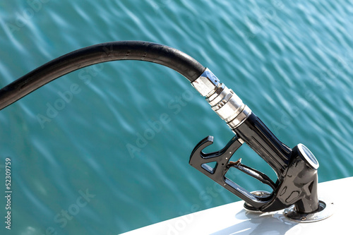 Diesel fuel pump refueling a motor boat