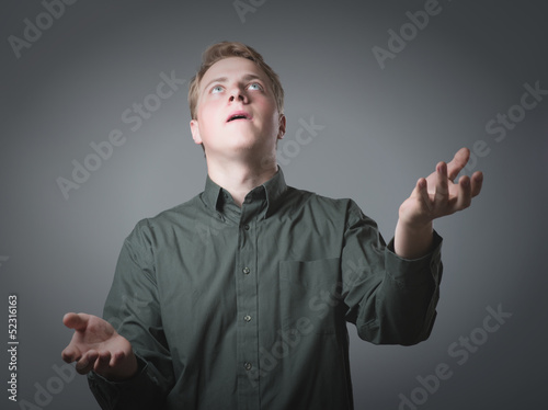 Young businessman juggling