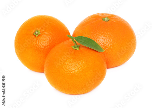 Three ripe mandarins on white background