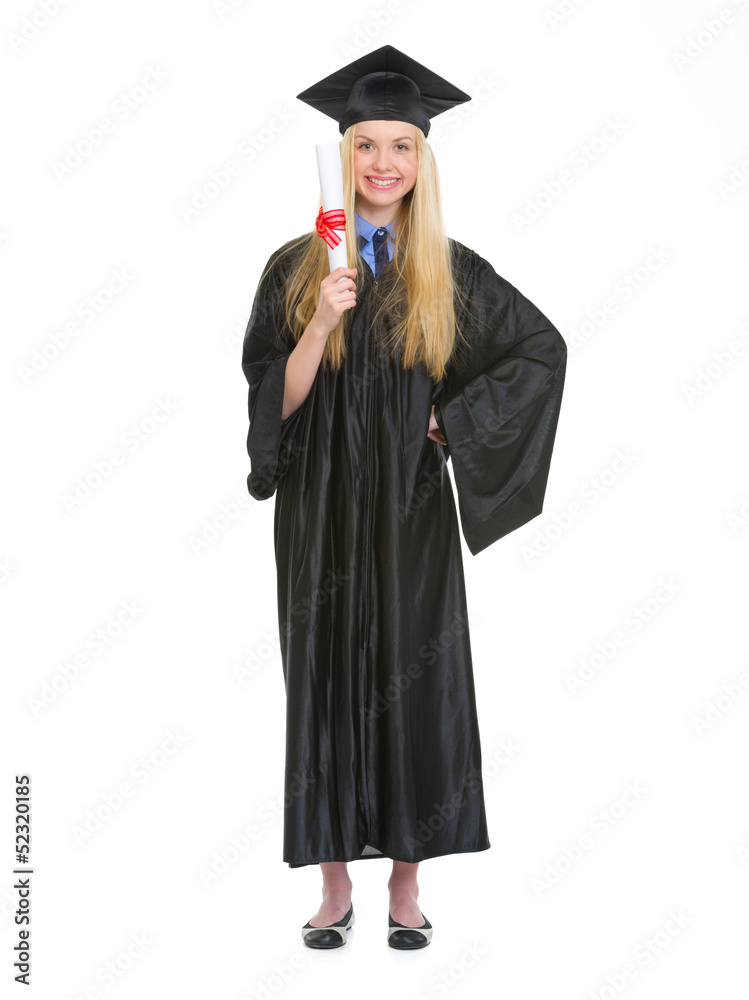 Full length portrait of woman in graduation gown showing diploma Full length portrait of woman in graduation gown showing diploma