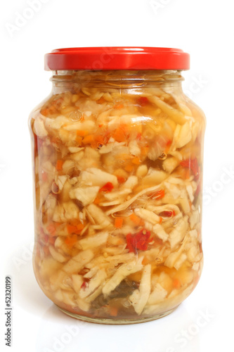 Preserved cabbage and red paprika salad in glass jar