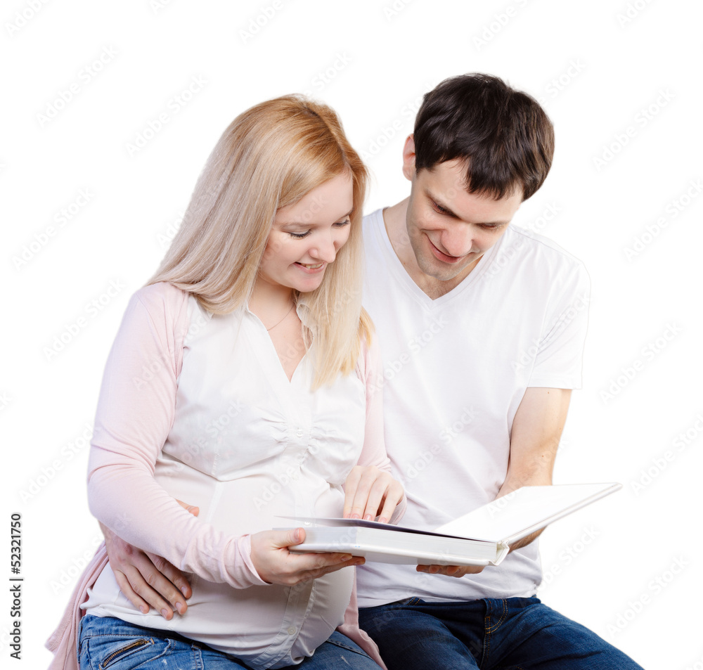 young happy couple with photo album young happy couple with photo album
