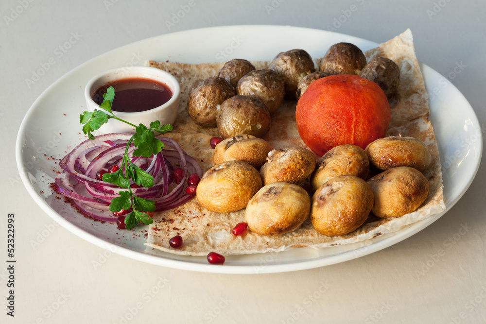 Appetizing dish with potatoes, mushrooms, tomato Appetizing dish with potatoes, mushrooms, tomato