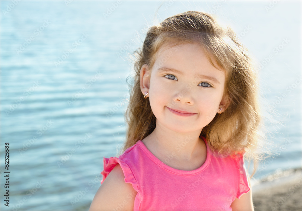 Adorable little girl on beach vacation Stock Photo | Adobe Stock