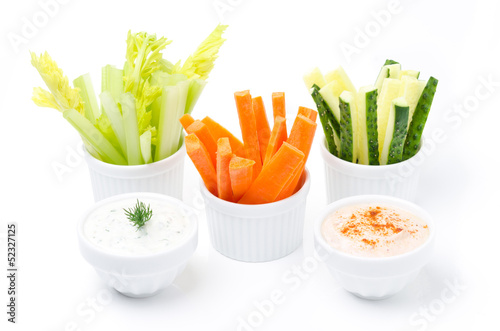 assorted fresh vegetables and two yogurt sauce isolated
