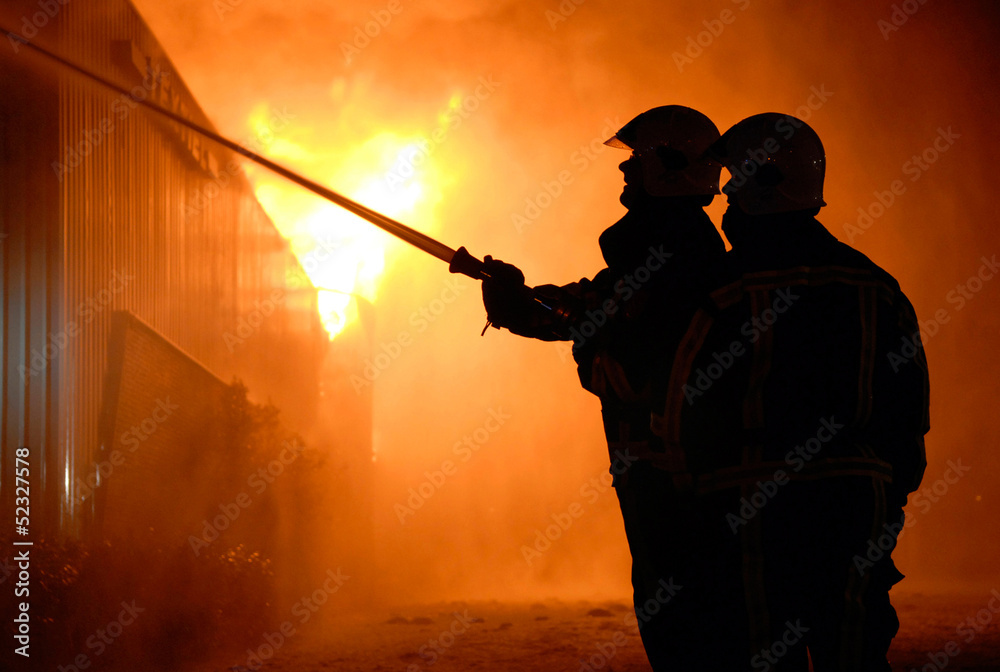 Naklejka premium Firefighters at work
