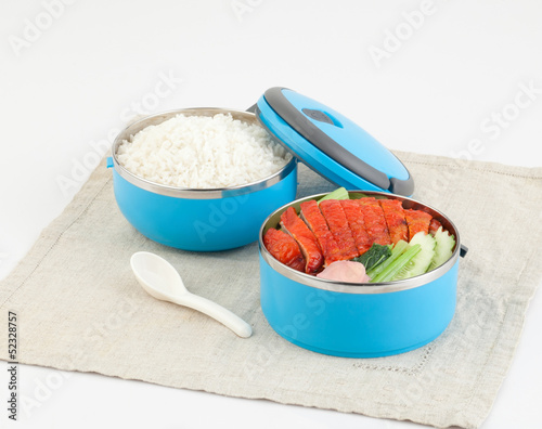 Cute tiffin carrier with rice and roasted duck photo