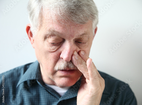 Tableau sur toile man with stuffy nose from allergies or cold