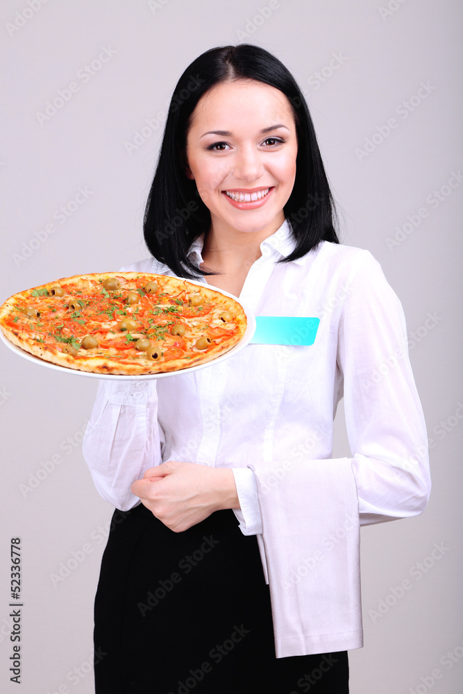 Beautiful girl waiter with pizza isolated on white Beautiful girl waiter with pizza isolated on white