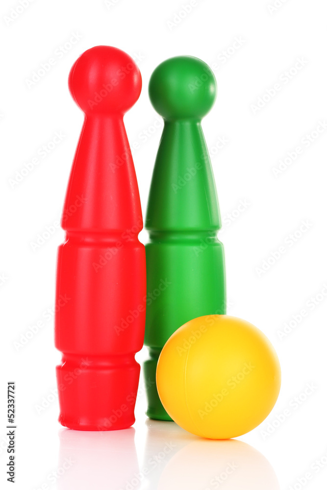 Colorful plastic skittles of toy bowling isolated on white