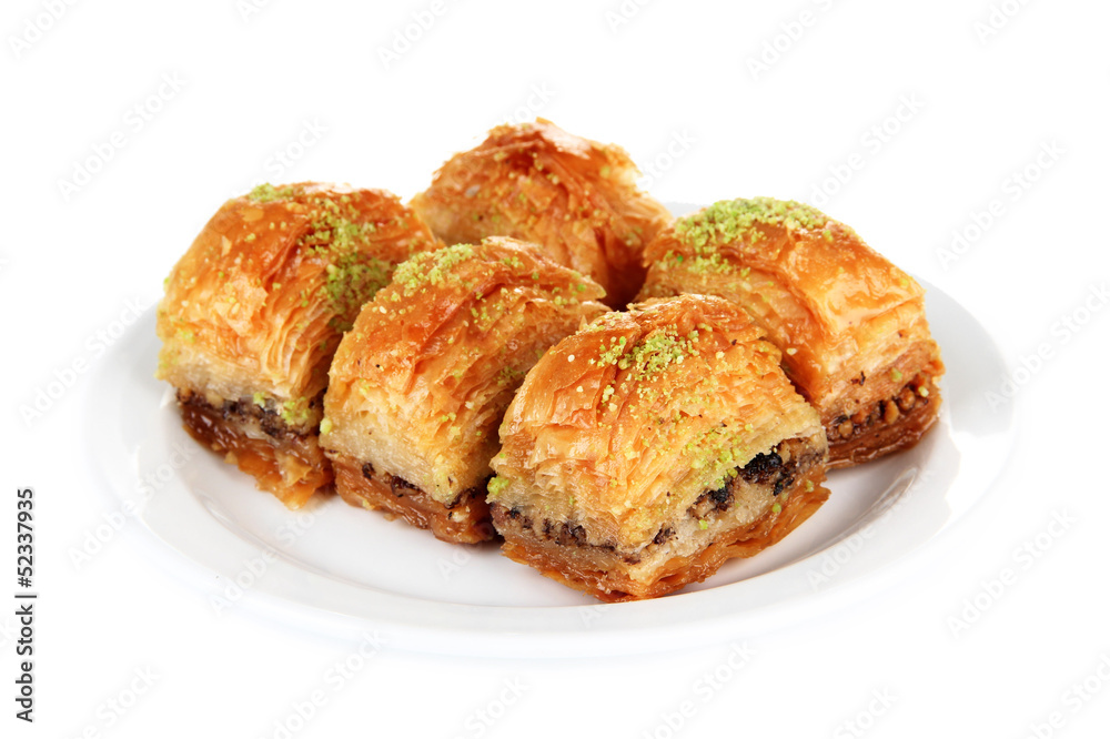 Sweet baklava on plate isolated on white