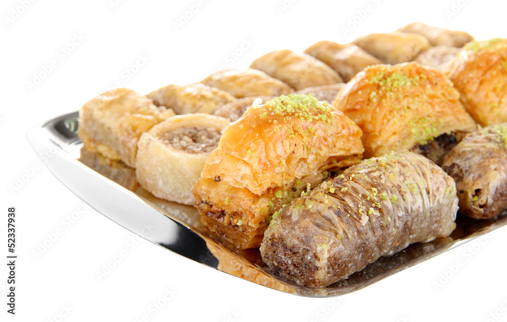 Sweet baklava on tray isolated on white Sweet baklava on tray isolated on white