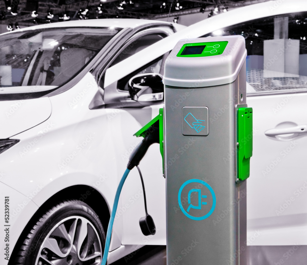 Plug-in electric car being charged. Plug-in electric car being charged.