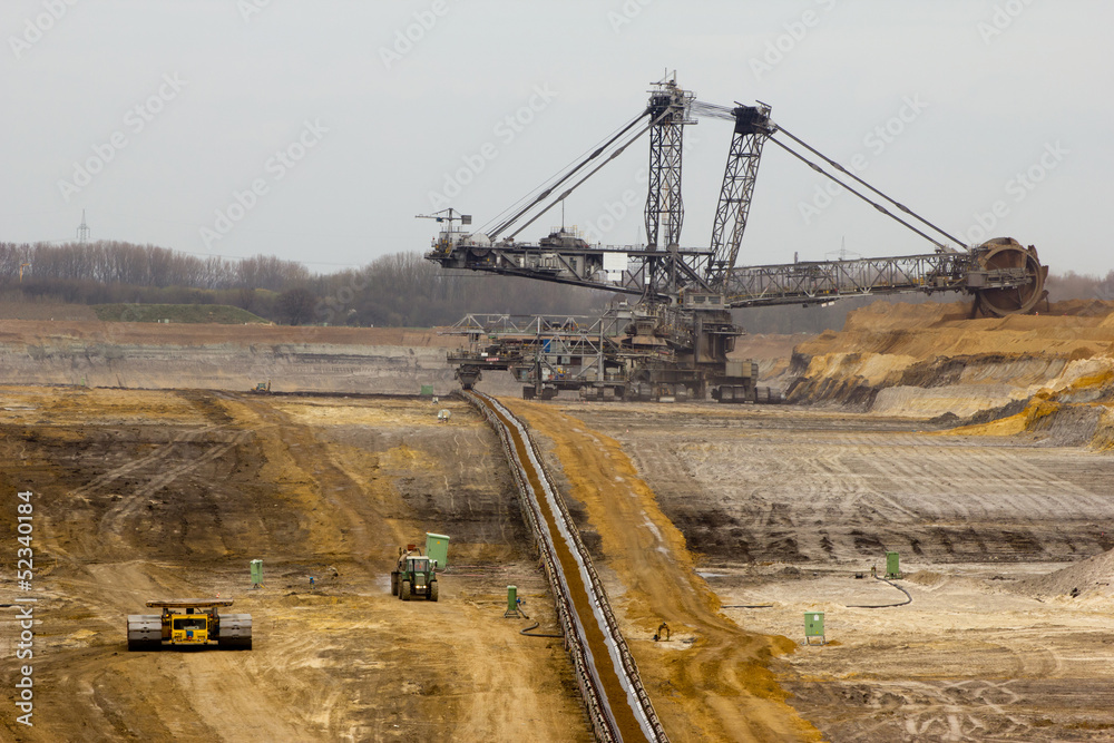 A conveyor-belt and excavator in a brown-coal mine A conveyor-belt and excavator in a brown-coal mine