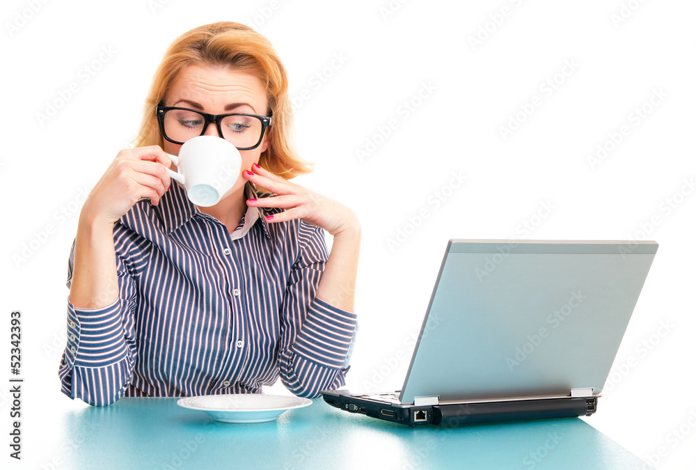 Happy business woman drinking coffee and watching in laptop