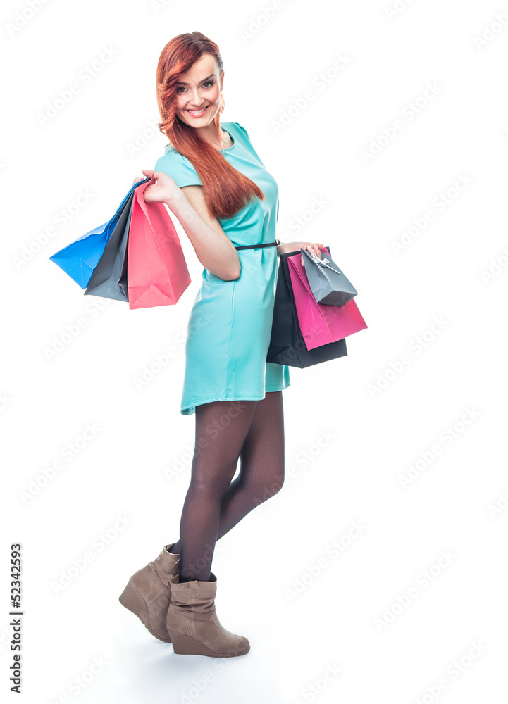 Smile girl with shopping bags, isolated on white background
