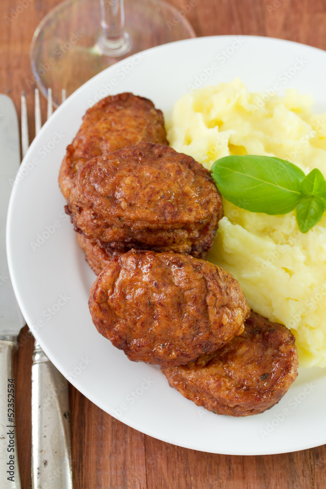 meatballs with mashed potato and basil