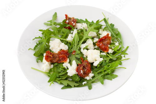 rucola with dry tomato and cheese