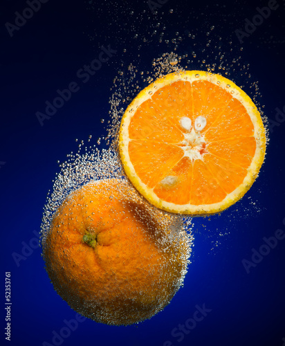 Fototapeta Naklejka Na Ścianę i Meble -  Beautiful orange close-up photo with carbon dioxide bubbles