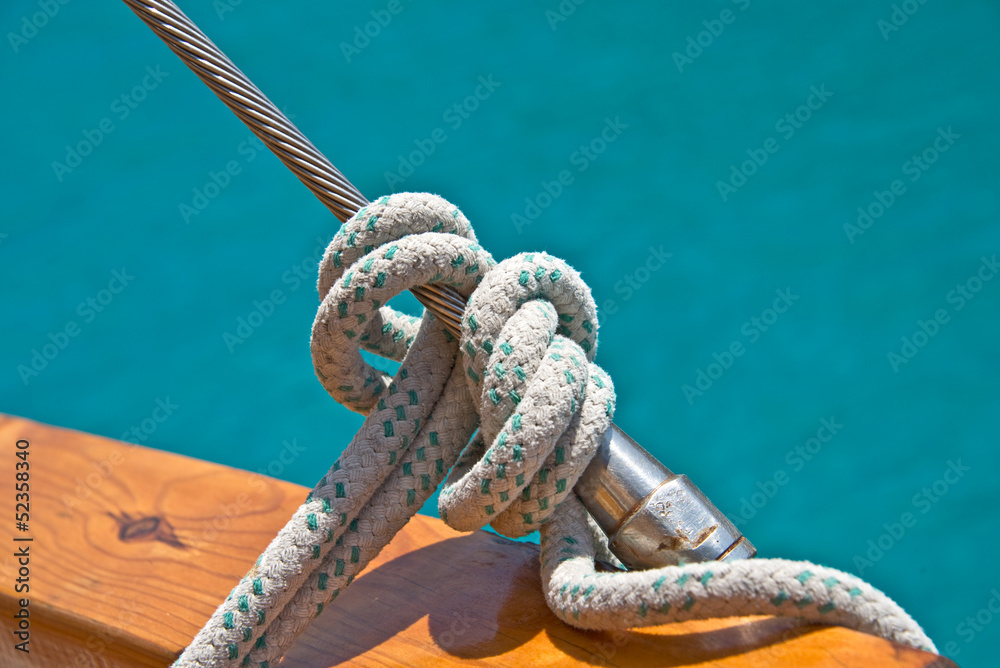 Fototapeta premium Noeud de marin, fond mer turquoise