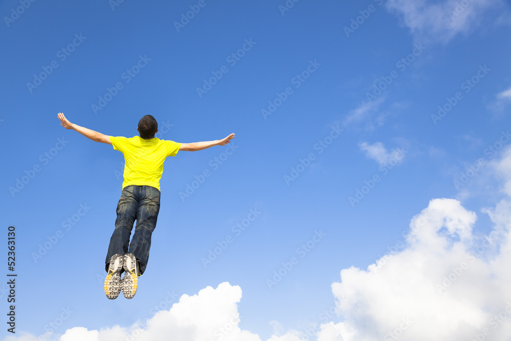 Fototapeta premium happy young man jumping