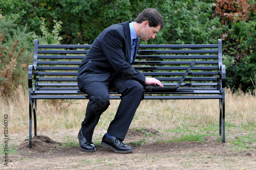 Businessman Working On Laptop Outdoors