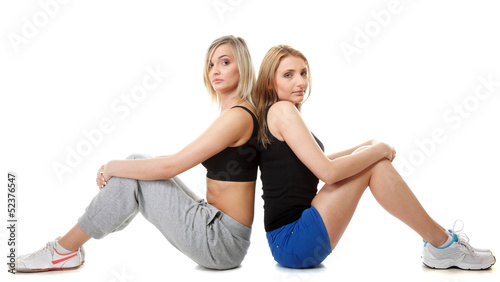 Two young sporty women after workout