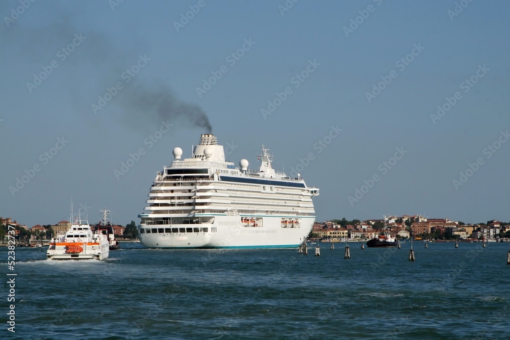 giant cruise ship for the transportation of passengers pulled by