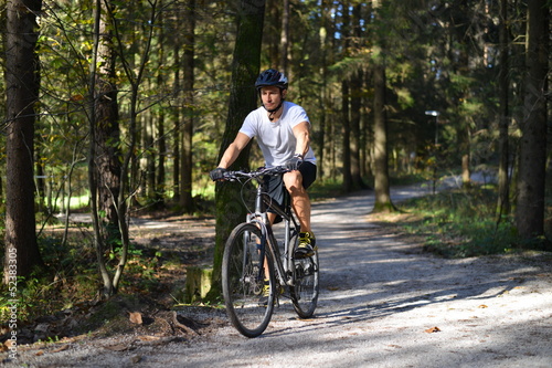 A mountain biker riding through a trail.