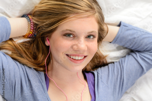 Portrait of relaxing young girl listening music