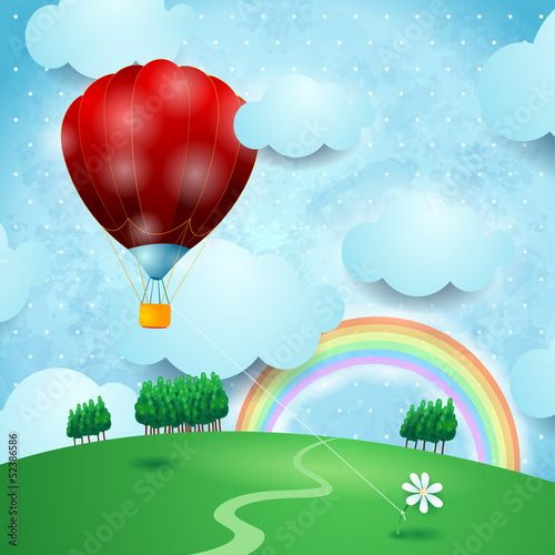 Hot air ballon on fantasy landscape