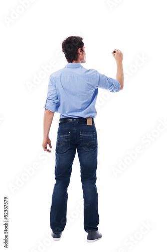 Adult male writing on the blank white wall