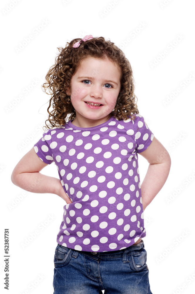 Young child stood smiling at the camera Young child stood smiling at the camera
