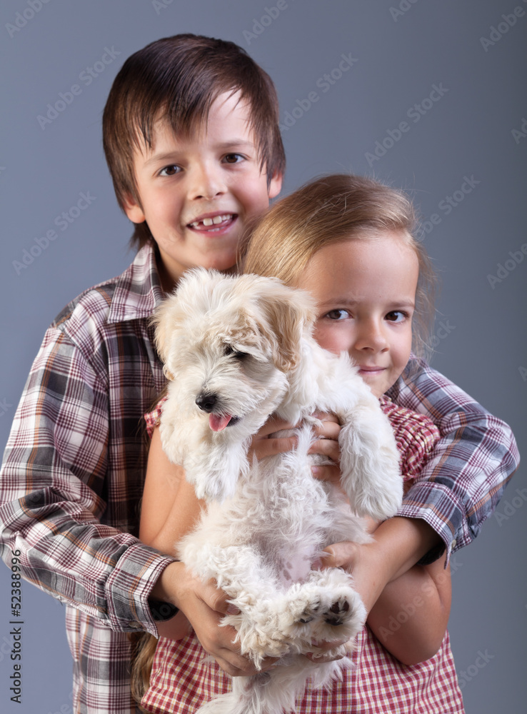 Happy kids holding their new pet Happy kids holding their new pet