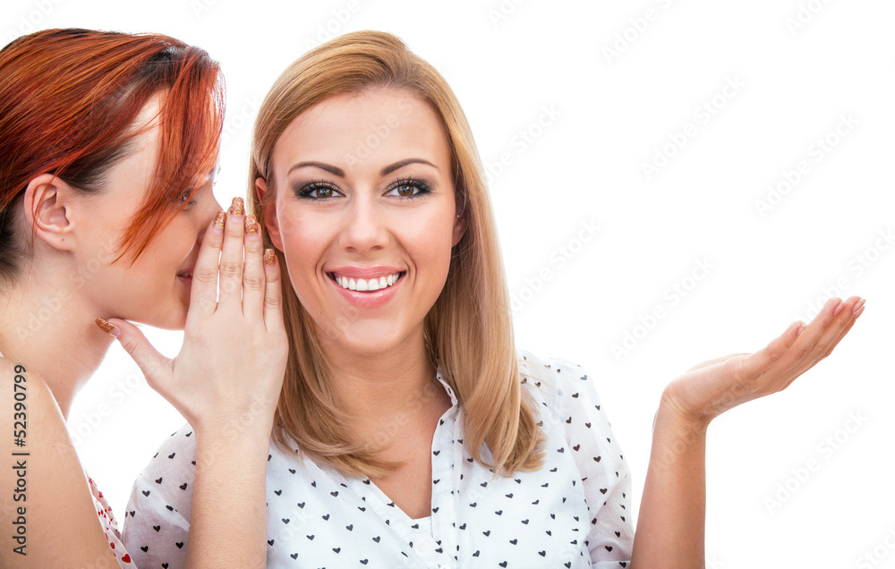 Two happy young girl friends talking or whispering Two happy young girl friends talking or whispering