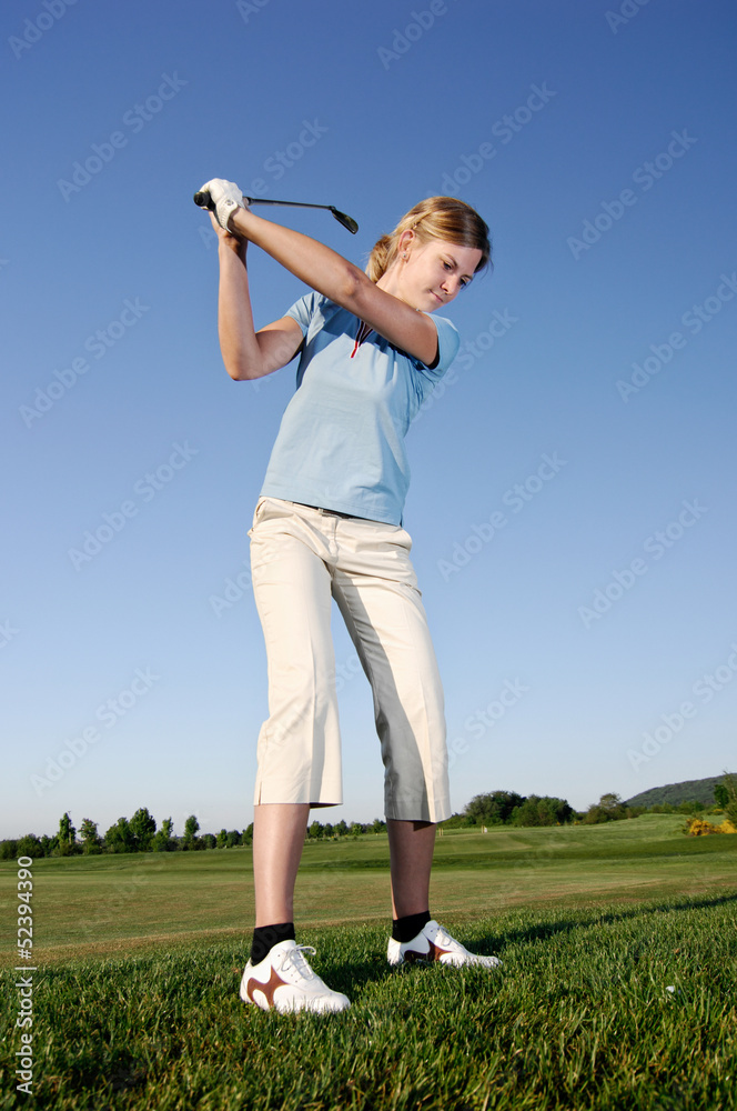 Golf serie, woman playing golf on a course Golf serie, woman playing golf on a course