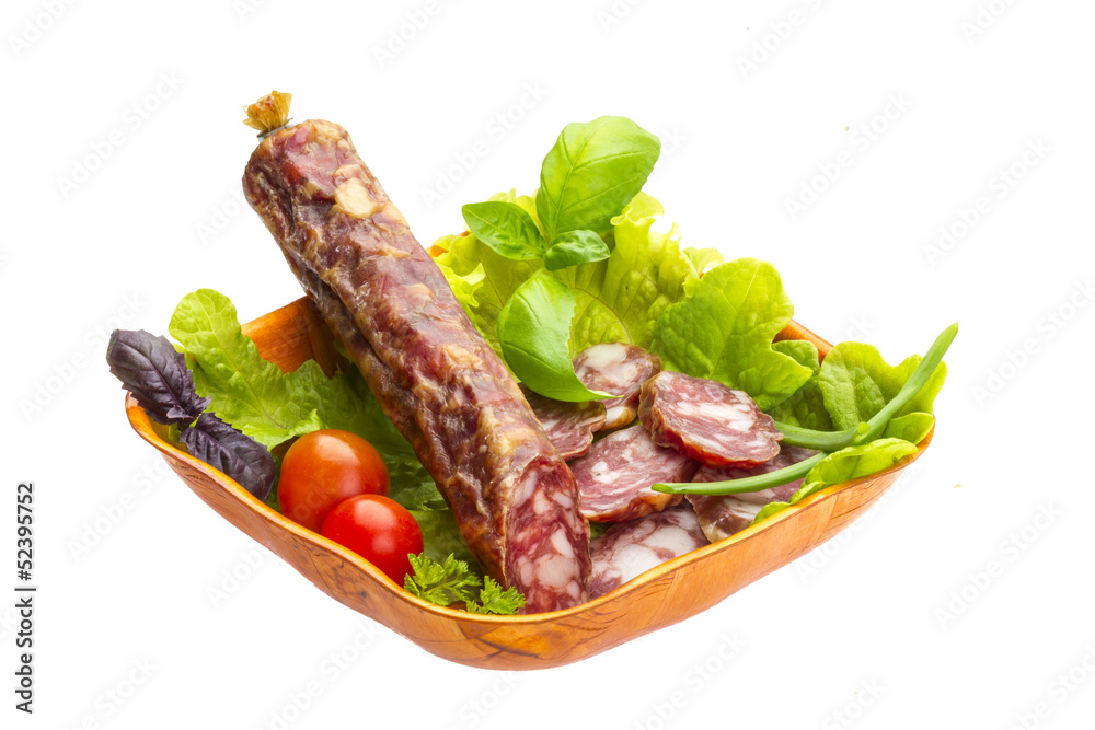 Ripe salami with salad, basil, onion and tomato Ripe salami with salad, basil, onion and tomato
