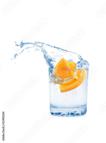 Orange in glass isolated on white background