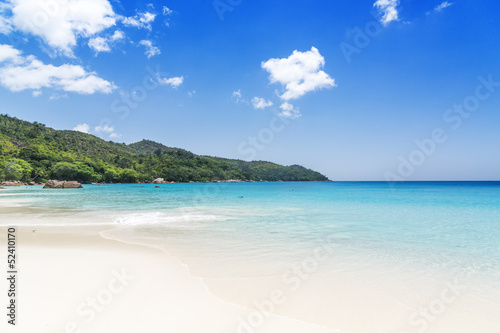 Fototapeta Naklejka Na Ścianę i Meble -  White coral beach sand and azure ocean. Seychelles islands.